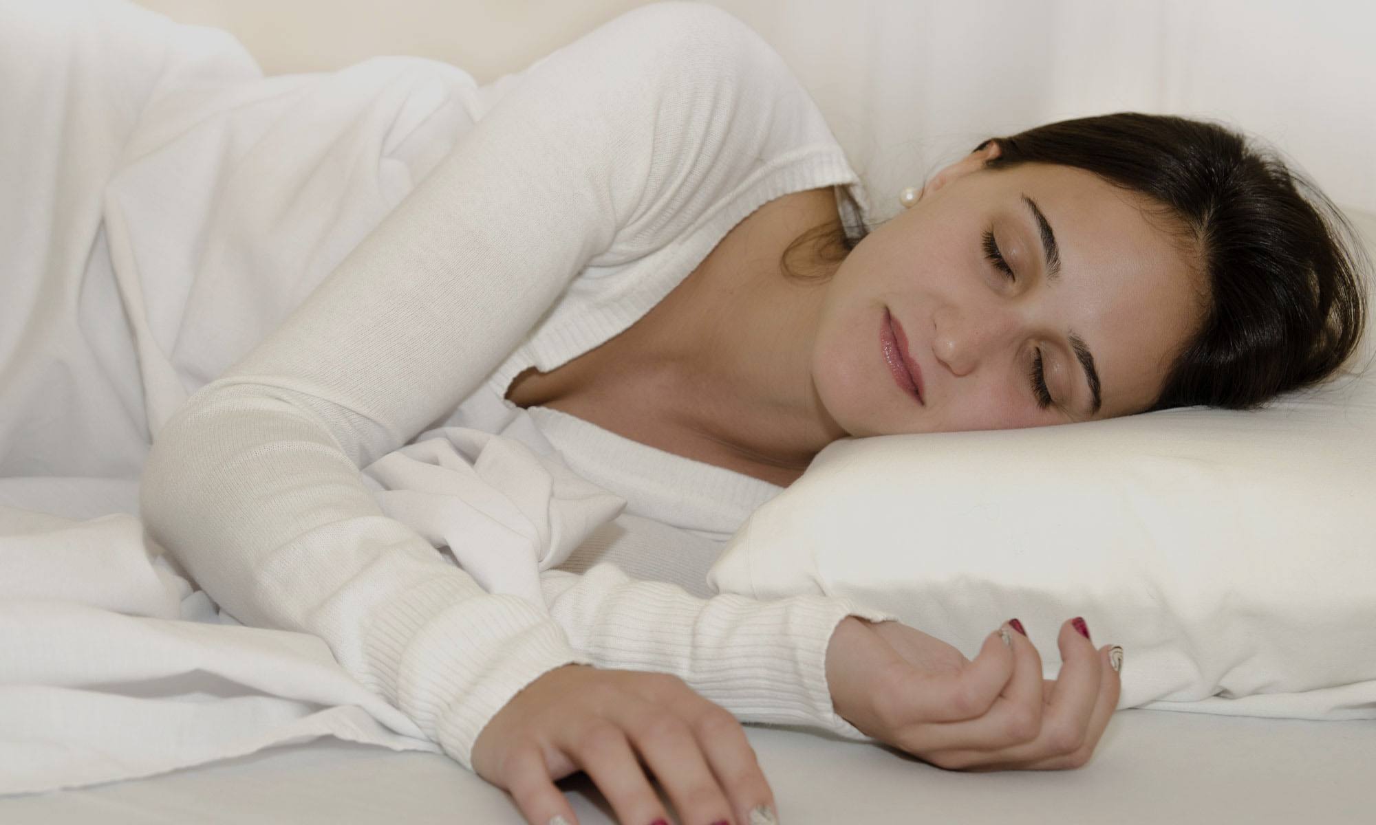 Woman sleeping after sleep apnea treatment